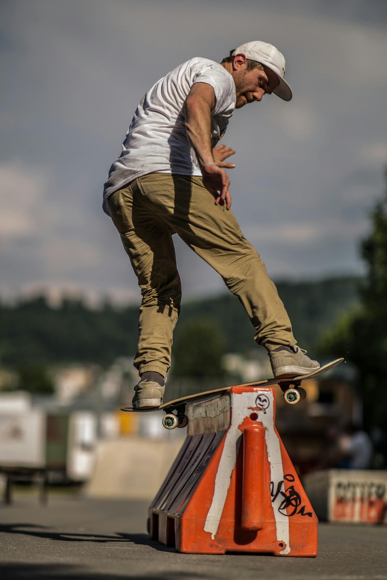 Skater mid-kickflip at golden hour